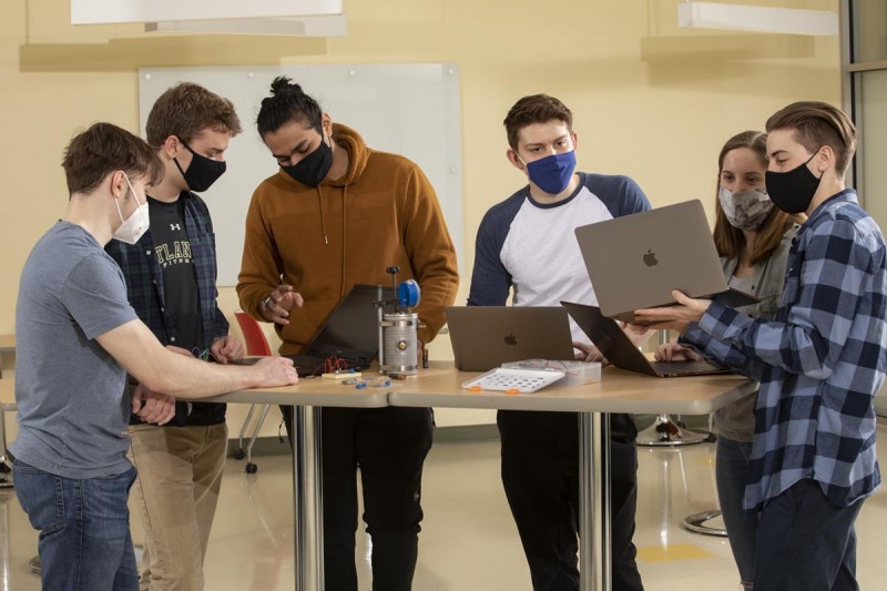 Biomedical engineering students, from left, David Yefroyev, Harry Olszewski, Tavish Srivastava, Andrea Russo, Megan DiBella and Randy Kipnis work together on their senior project.