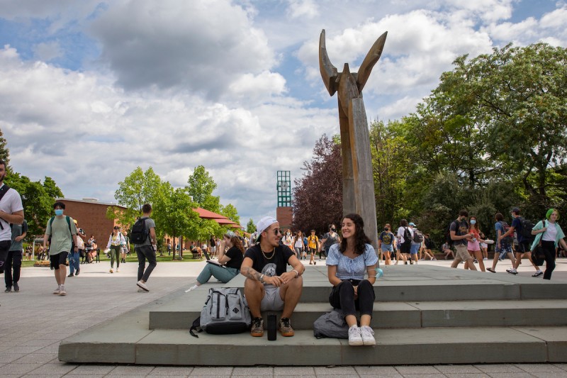 Binghamton University students walking through campus along the Lois DeFleur Walkway, August 30, 2021.