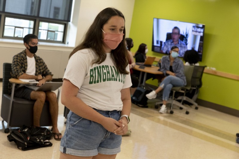 Student Jess Morgan listens to Alexander Vindman '98, a retired United States Army lieutenant colonel who was the Director for European Affairs for the United States National Security Council, \answer a question she had asked.