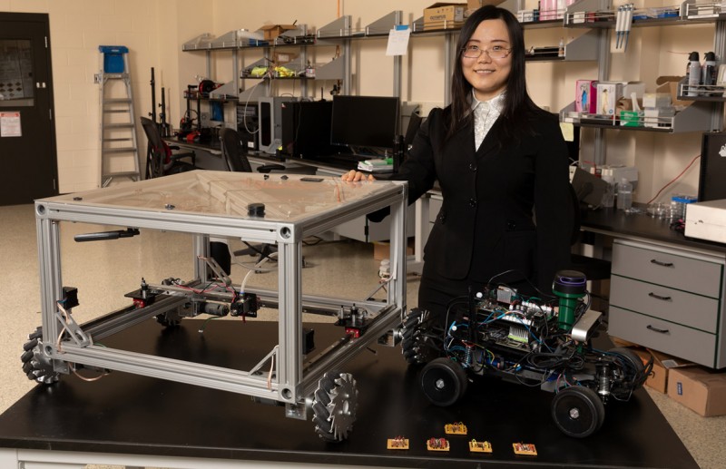 Assistant Professor Kaiyan Yu, a faculty member in the Department of Mechanical Engineering at Binghamton University’s Thomas J. Watson College of Engineering and Applied Science, works with robots on the macro- and microscale.