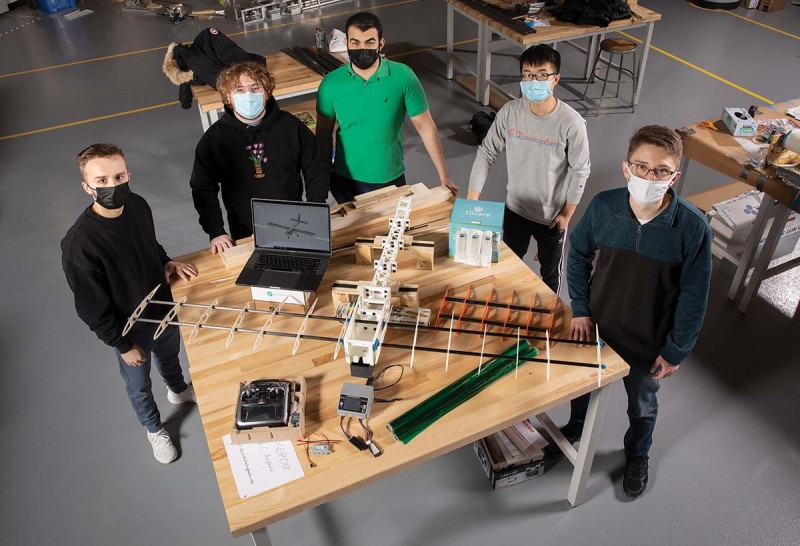 A team including mechanical engineering students, from left, Brian Lineback, Ilan Bregman and
Marwan Gomaa, and electrical engineering students Xiaofei Li and Daniel Coladangelo are building an unmanned radio-controlled plane that can deliver vaccine components.