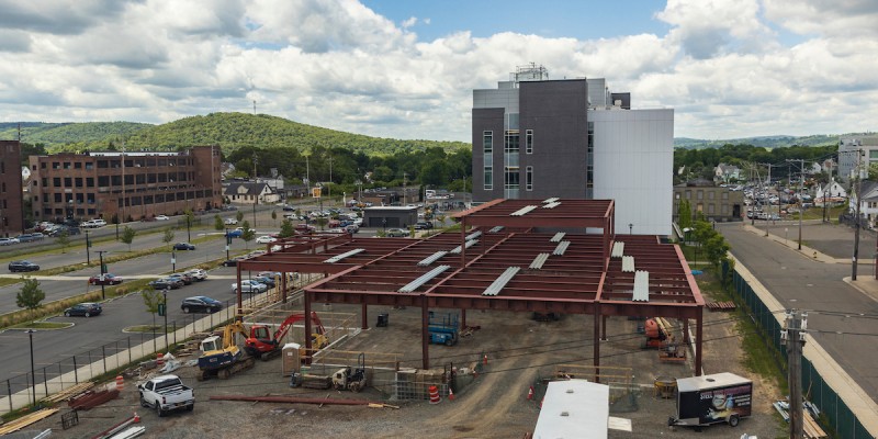 The steel went up in June for the new R&D building adjacent to the School of Pharmacy and Pharmaceutical Sciences Building at the Health Sciences Campus in Johnson City. Construction is expected to be completed in early 2023.