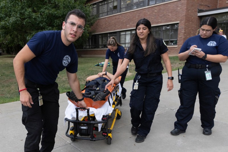 Harpur’s Ferry and Emergency Medical Technicians from SUNY Geneseo, University at Albany and Syracuse University conduct a mock disaster drill that simulated a mass casualty incident (MCI) in the Fine Arts Building on Aug. 17, 2022.