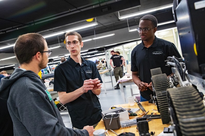 From left to right, Matt Arndt, Zev Blumenthal and James Raymond work together on the Binghamton University Rover Team's entry this spring in the Fabrication Lab at the Engineering Building.