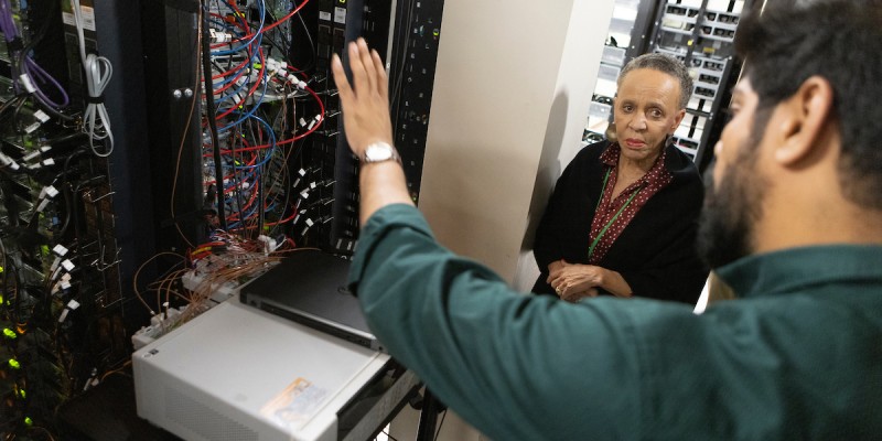 N. Joyce Payne, founder of the Thurgood Marshall College Fund, gets a tour of the Center of Excellence Data Center led by Research Assistant Professor Srikanth Rangarajan as part of the Emerging Technology and Broadening Participation Summit.