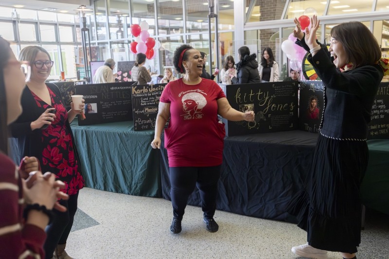 Binghamton University's College of Community and Public Affairs' Department of Social Work DE&I Committee celebrates women during the One Billion Rising 2024 event. Kelley Cook, left, Monica Adams, middle, and Mina Lee, right — all assistant professors of social work — are shown here, dancing in solidarity.