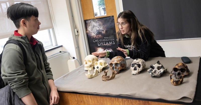 PhD student Cai Caccavari leads a discussion in the Paleonthropology Lab for World Anthropology Day.