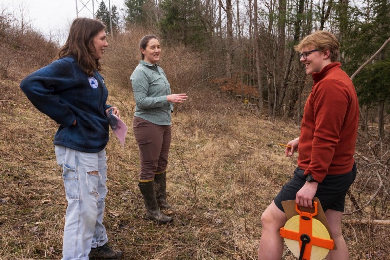 Binghamton University Assistant Professor of Ecosystem Science Amber Churchill, center, instructs her ENVI 382B: Measuring the Natural World class at Nuthatch Hollow.
