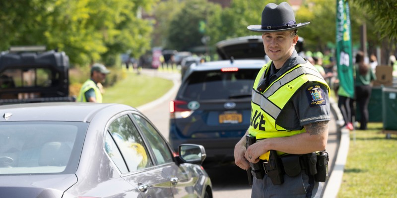 A University Police Officer directs traffic on campus.
