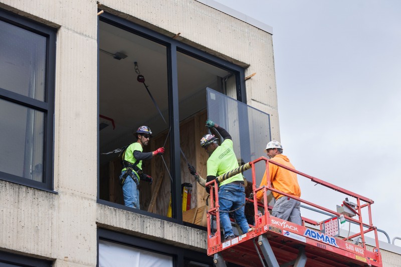 Work crews install bird-save windows at Science III on Sept. 24, 2024.
