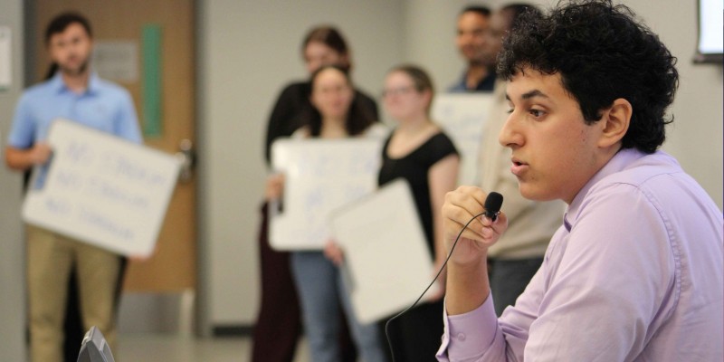 Mohamed Deumah, a second-year PharmD student, giving a press conference as the town's mayor during the emergency management simulation at the School of Pharmacy and Pharmaceutical Sciences.