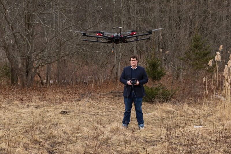 Assistant Professor Jayson Boubin programs drones to find and analyze issues on the ground, including invasive species and landmines.