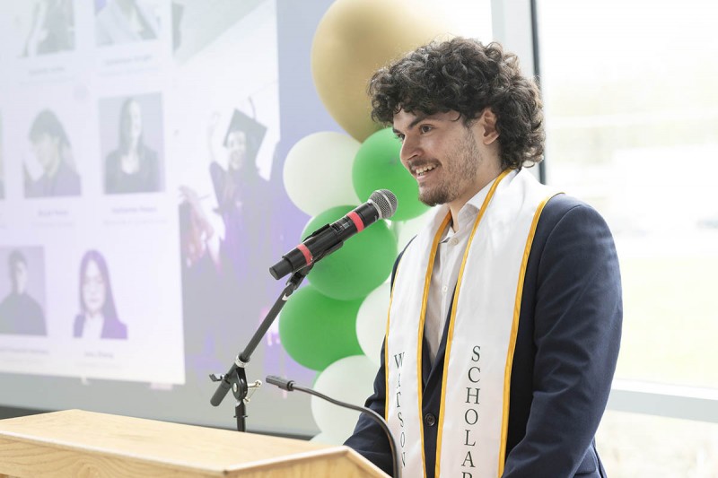 Christian Martinez '25 spoke at the Watson College Scholars Program end-of-year event in May at the Innovative Technologies Center. He says he considers some of his fellow scholars among his closest friends.