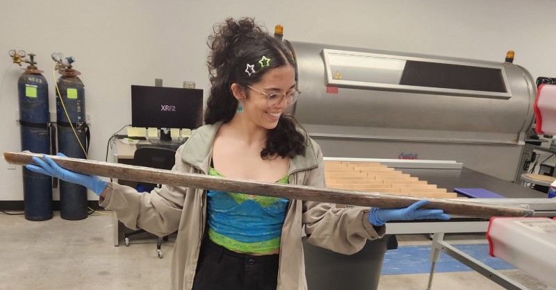 Sofia Corsico-Sánchez holds a sediment core during her summer research experience at the OCEAN CORE Academy in College Station, Texas.
