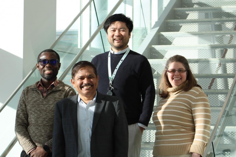 New SOPPS faculty members Associate Professor John Fetse (left), Assistant Professor Yuanjun “Steve” Shen (back center) and Clinical Assistant Professor Kelly Bach (right) pose with Dean and SUNY Distinguished Professor Kanneboyina Nagaraju (front center) on the stairs of the atrium inside the School of Pharmacy and Pharmaceutical Sciences.