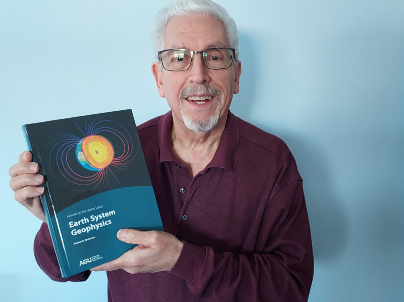 Professor Emeritus of Earth Sciences Steven Dickman and his new textbook, Earth System Geophysics.