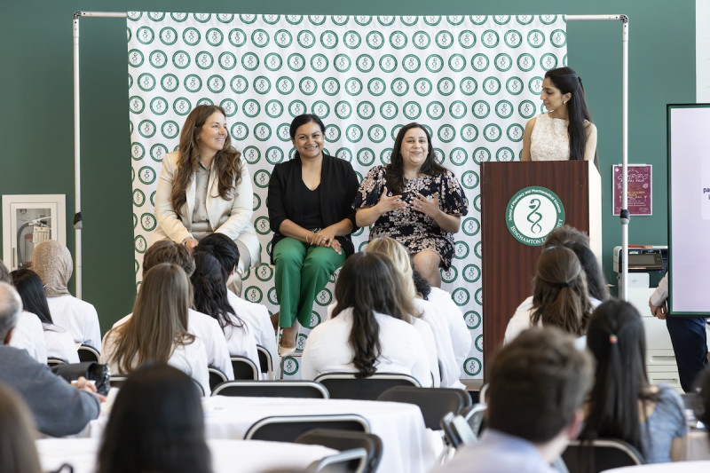 The Phi Lambda Sigma Induction Ceremony was held on Friday, April 17. The keynote panel, introduced by P4 student Heeral Naik (standing at right), featured leaders in the pharmaceutical industry (sitting from left to right): Lucrecia Campisi, Sara Asif Spencer, and Sandi Khalla.
