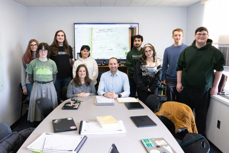 Associate Professor of Spanish and Linguistics Bryan Kirschen and Associate Professor of Judaic Studies and History Dina Danon co-teach a class in which students work with the organization JewishGen to transliterate family records written in Judeo-Spanish from Salonica, Greece (1934-1935). The group pictured here is meeting at the Glenn G. Bartle Library tower, April 21, 2026.
