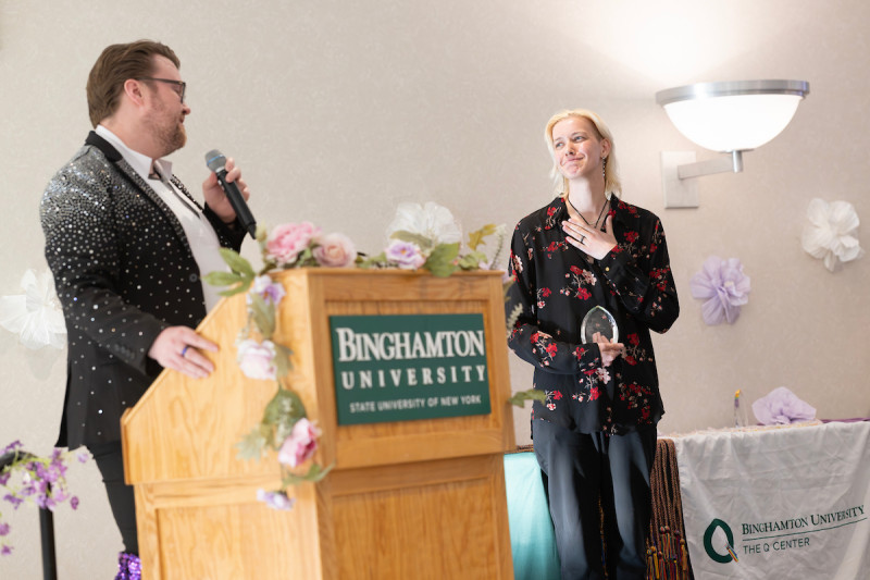 Associate Director Nick Martin presents the Activism Award to Mims Harrington, a double major in Social Work and Women, Gender, and Sexuality Studies.