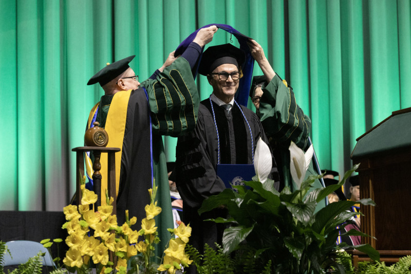 Harpur College alum William H. Groner ’77 receives an honorary doctorate during the first Harpur Commencement ceremony on May 16, 2026.