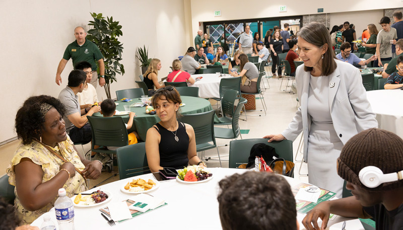 President Anne D'Alleva greets new students and their families on Aug. 14, 2026.
