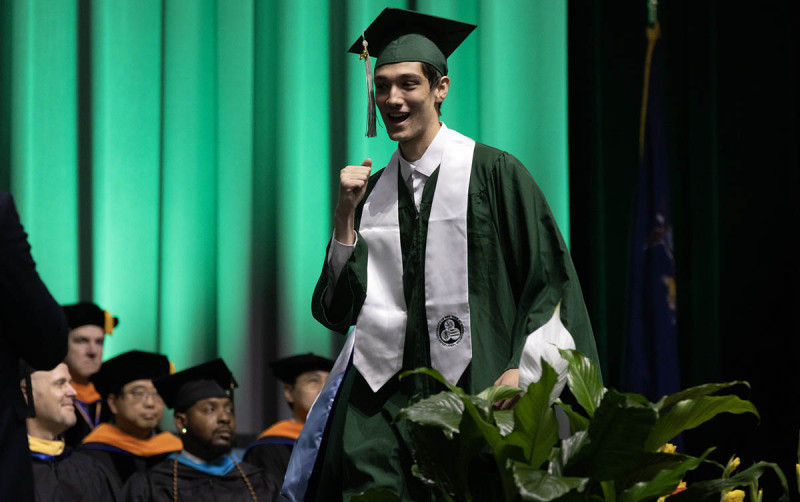 A graduate celebrates after earning his bachelor's degree at the 2026 Commencement ceremony for Binghamton University's Thomas J. Watson College of Engineering and Applied Science.