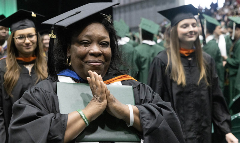 A graduate celebrates after earning her master's degree at the 2026 Commencement ceremony for Binghamton University's Thomas J. Watson College of Engineering and Applied Science.