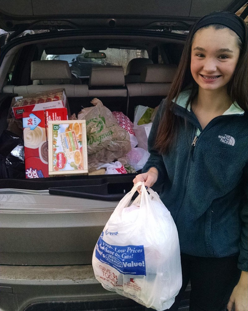 Alexis Green in 2015, transporting donated items to the food pantry.