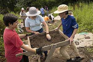 Community Archaeology Program participants take part in a summer 2024 dig in Nichols, N.Y., 20 miles west of the Binghamton University campus. The weeklong program offers archaeological experience and education to kids, teens and adults.