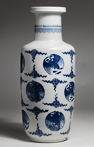 A Chinese porcelain rouleau vase from the 1661-1722 period of the Qing Dynasty is on display at 