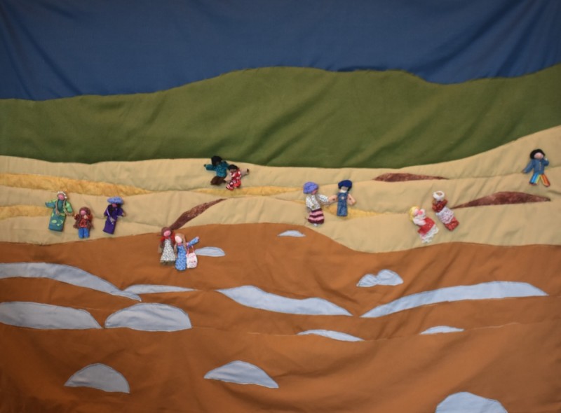 This quilt illustrates the heart-wrenching scene of families and communities uprooted by climate disasters – forced to abandon their homes, lands, and histories in search of safety and shelter. Each stitch captures a story of loss, resilience and the profound human cost of a rapidly warming world. The combined forces of sea level rise, intensified tropical storms, flooding, drought, wildfires, extreme heat and land desertification will make parts of the Earth unlivable. It is anticipated that millions of people will be displaced as a result of climate change. Some may be displaced by these impacts directly, while others may be forced to migrate due to political instability that can be triggered by rising food prices and resource shortages.