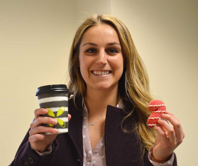 Jenna Fetterman, a Baccalaureate Accelerated Track student at the Decker School of Nursing, grabs a cup of hot coffee and a holiday cookie at the school's Hot Cocoa and Coffee Bar event Dec. 11. Fetterman is from Endwell, N.Y.