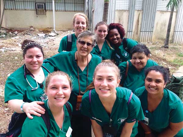 For more than a decade, Clinical Associate Professor Laura Terriquez-Kasey, center with glasses, has taken undergraduate students to the Dominican Republic to provide healthcare. This is the group from 2016, which included Decker Clinical Instructor Socorro Osorio, center row, right.