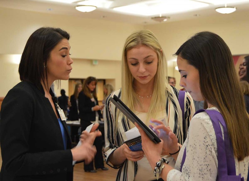 From left: Ann Freer of Rochester Regional Health discusses employment opportunities with Decker students Bridget Alapeck and Rosemary Zeleynak.
