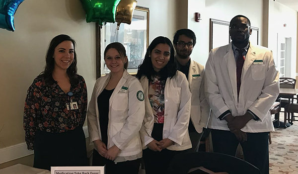 PharmD students from Binghamton University's School of Pharmacy and Pharmaceutical Sciences participated recently in a medication take-back at Good Shepherd Village at Endwell. From the left: PGY-2 Resident Elizabeth Feldman, PharmD, BCPS; Caitlyn Brown; Helen Benjamin; Umar Ahmed; and Lambert Egbuchulam.