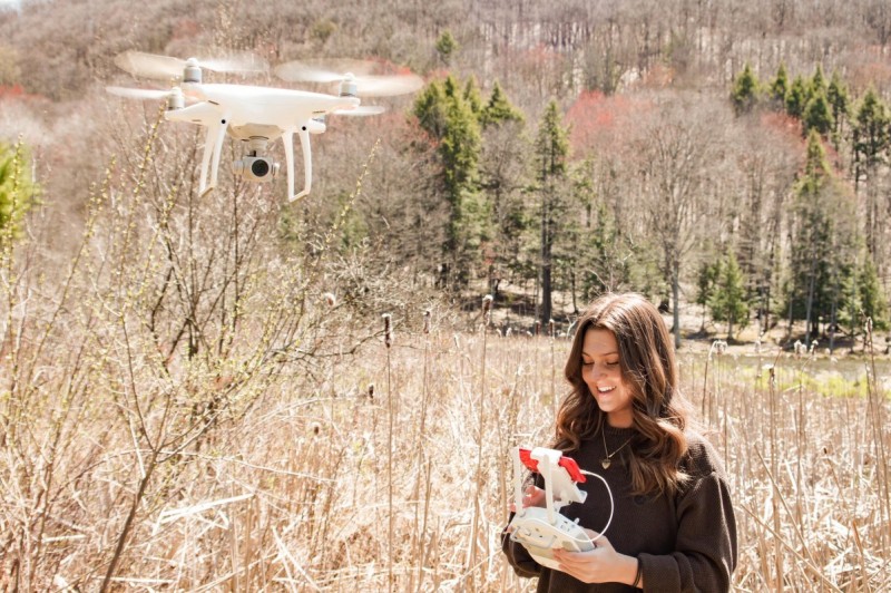 Geophysics major Madison Tuohy flies a Phantom 4 drone, a type commonly used in Binghamton University's Geophysics and Remote Sensing Lab.