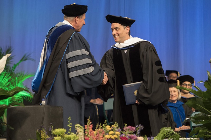 Nathan Englander'91 is greeted by Provost Donald Nieman during the Graduate School Commencement ceremony on May 19.