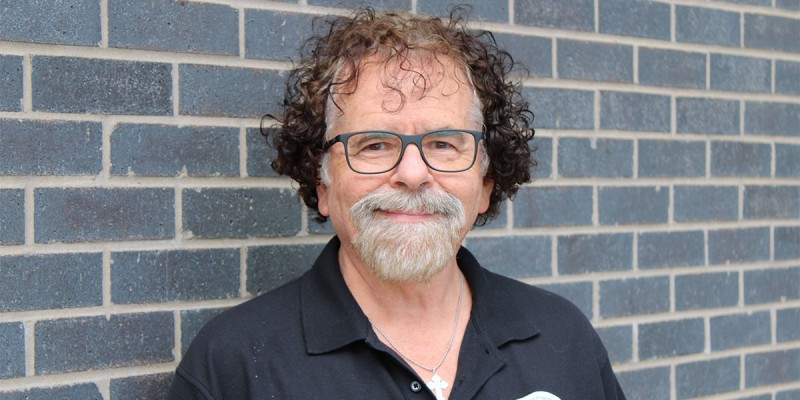 Clinical Assistant Professor Eric Richards standing outside the Binghamton University School of Pharmacy and Pharmaceutical Sciences