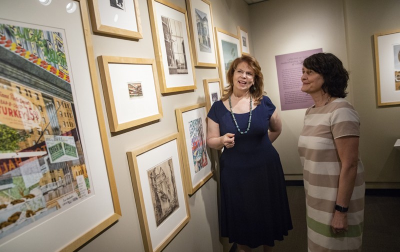 Diane Butler, Binghamton University art director, left, and Pamela Smart, associate professor of art history, have helped students find ways to engage with University-related art.
