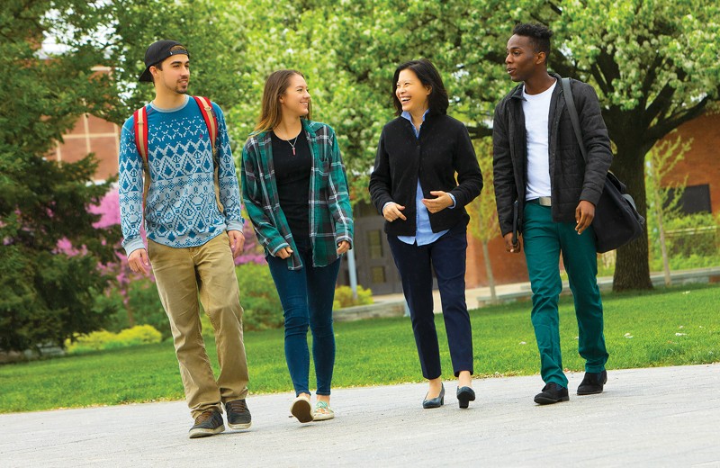 Lisa Yun, an associate professor of English and Asian and Asian American Studies, walks with students from her Spring 2018 Community Engagement class. From left are Scott Gardner, Cheyenne LaFrance and Khaliq Spruill.