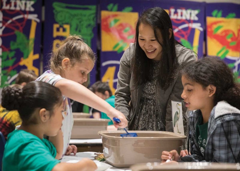Jessica Hua, assistant professor of biological sciences, shares her work with third-graders at the Roberson Museum and Science Center.