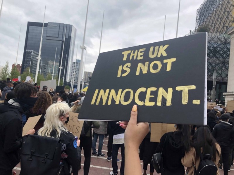 Protest signs at a Black Lives Matter march in Birmingham, England.