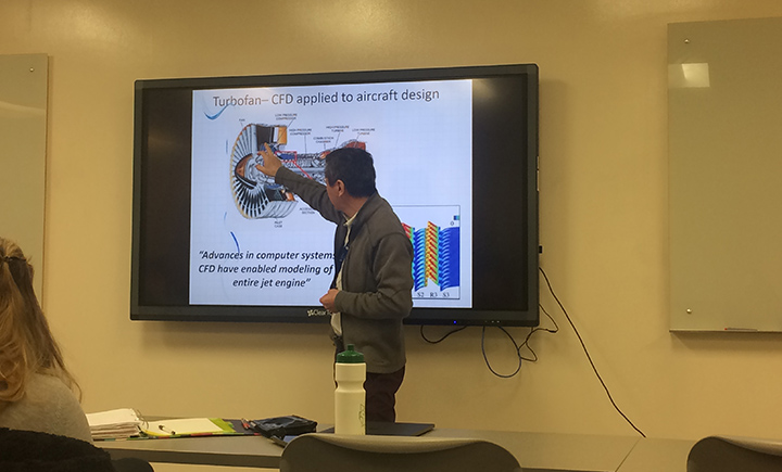 Jason Tan, senior technologist for Unison, speaking to professor Bruce Murray's computational fluid dynamics course.