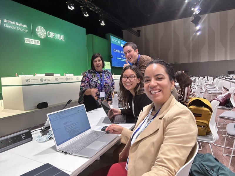 Lívia Maciel Braga, Cynthia Tan, Ana Sanchez-Bachman and Lorena Aguilar, (front to back) are pictured participating in the first event of COP28.