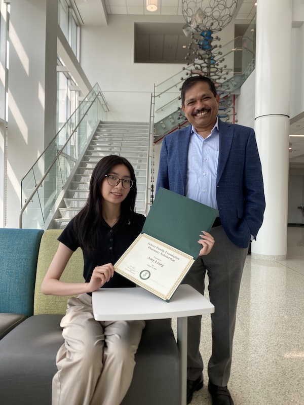 Amy Liang ’26 (left) was presented with the MS Pharmaceutical Sciences Scholarship by Dean Kanneboyina Nagaraju (right).