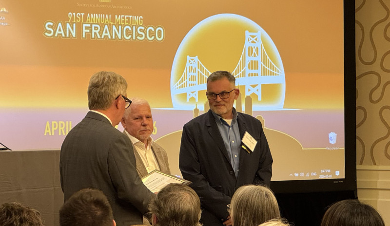 Professor Carl Lipo (right) receives the 2026 SAA Award for Excellence in Archaeological Analysis, which he shared with longtime research collaborator Terry Hunt.