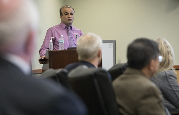Mohammad Khasawneh, professor and chair of systems science and industrial engineering and associate director of the Watson Institute for Systems Excellence (WISE), presents background and preliminary recommendations on a plan to make Binghamton University a preferred destination for international students to a group of administrators, faculty and staff.