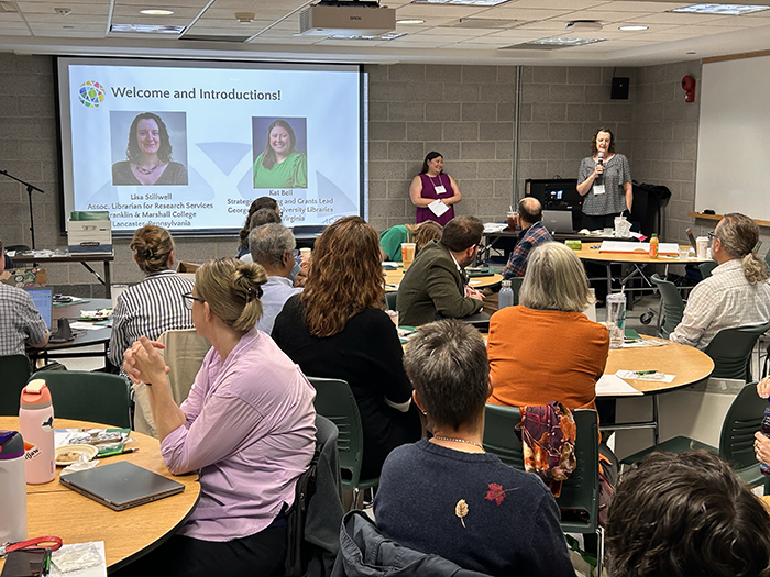 Co-presenters Lisa Stillwell and Kat Bell lead a welcome and introductions at the Planning, Assessing and Communicating Library Impact workshop at Binghamton University on Sept. 12.