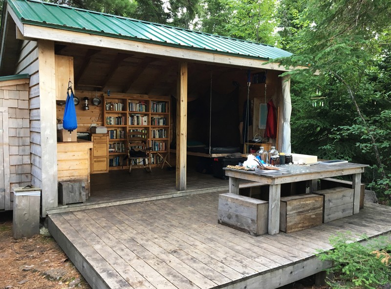 Rabbit Island features a small, three-walled cabin with a bed, kitchen and bookshelves.