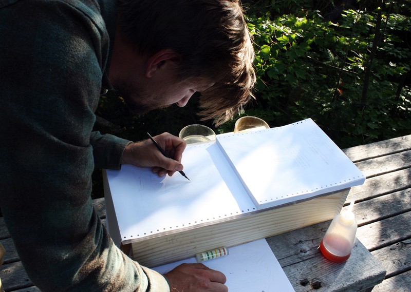 Colin Lyons uses sulfuric acid to transcribe a mid-1970s congressional document that will become a core part of The Laboratory of Everlasting Solutions.
